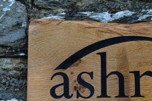 A wooden plaque with the engraved text 'CHILTERN PUBLISHING' set against a natural background.