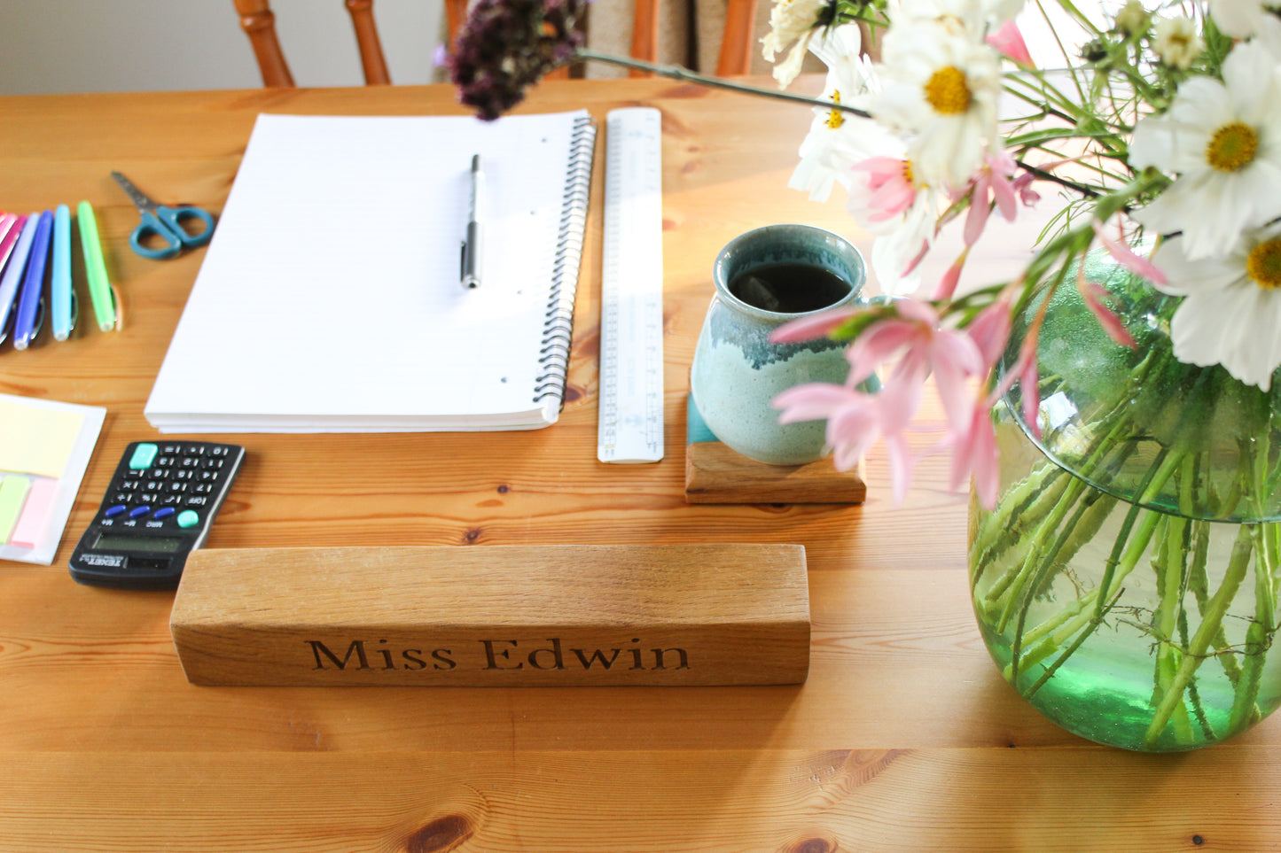 Teacher's desk with wooden name plaque