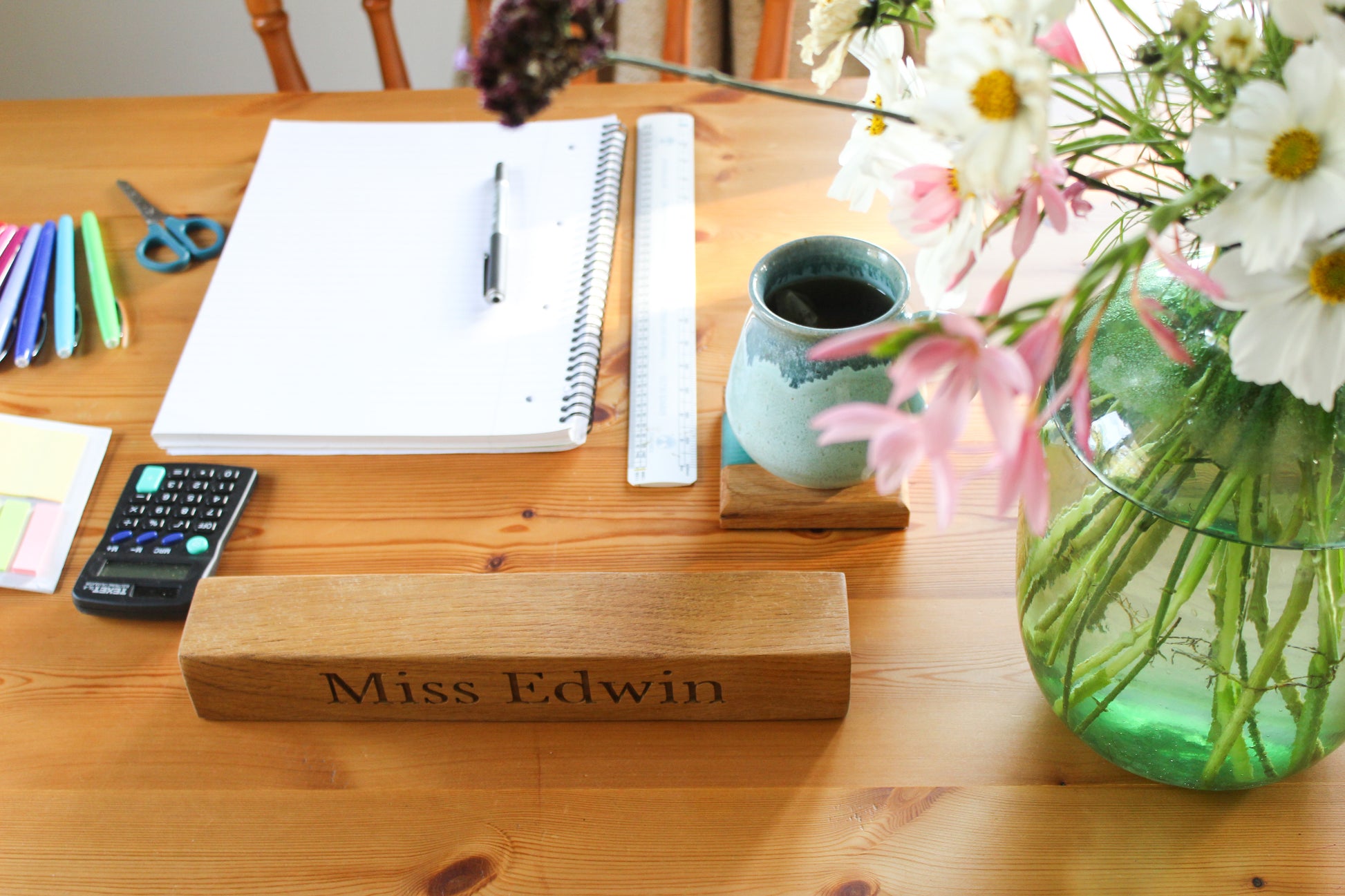 Teacher's desk with wooden name plaque