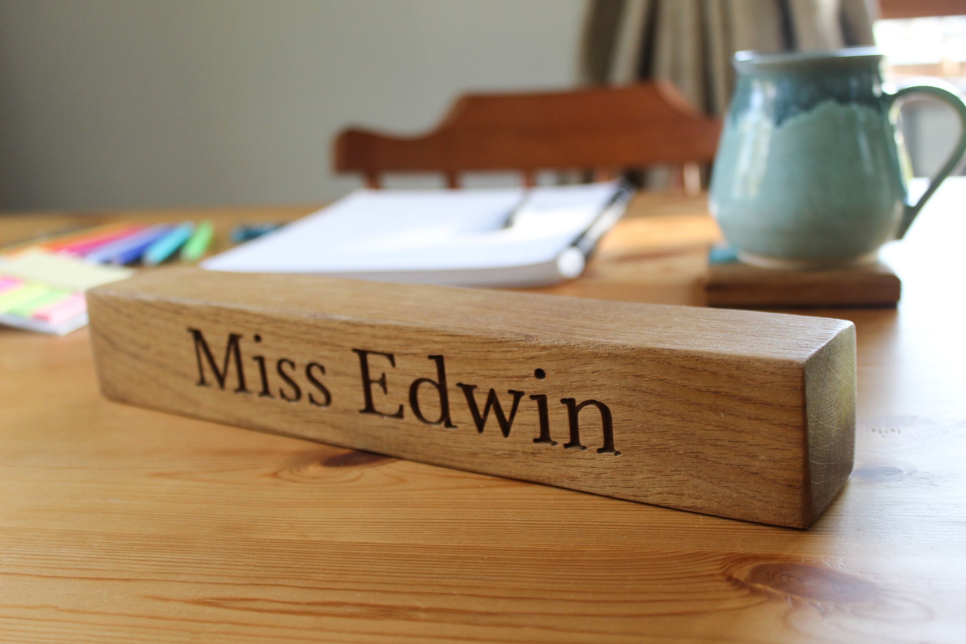 Teacher's desk with wooden name plaque