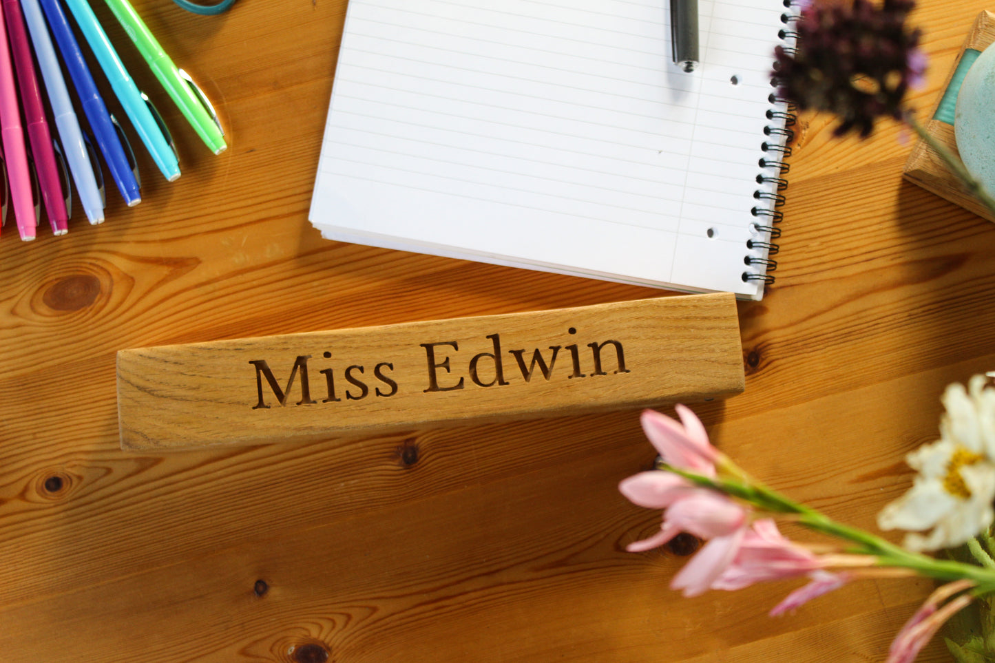 Teacher's desk with wooden name plaque