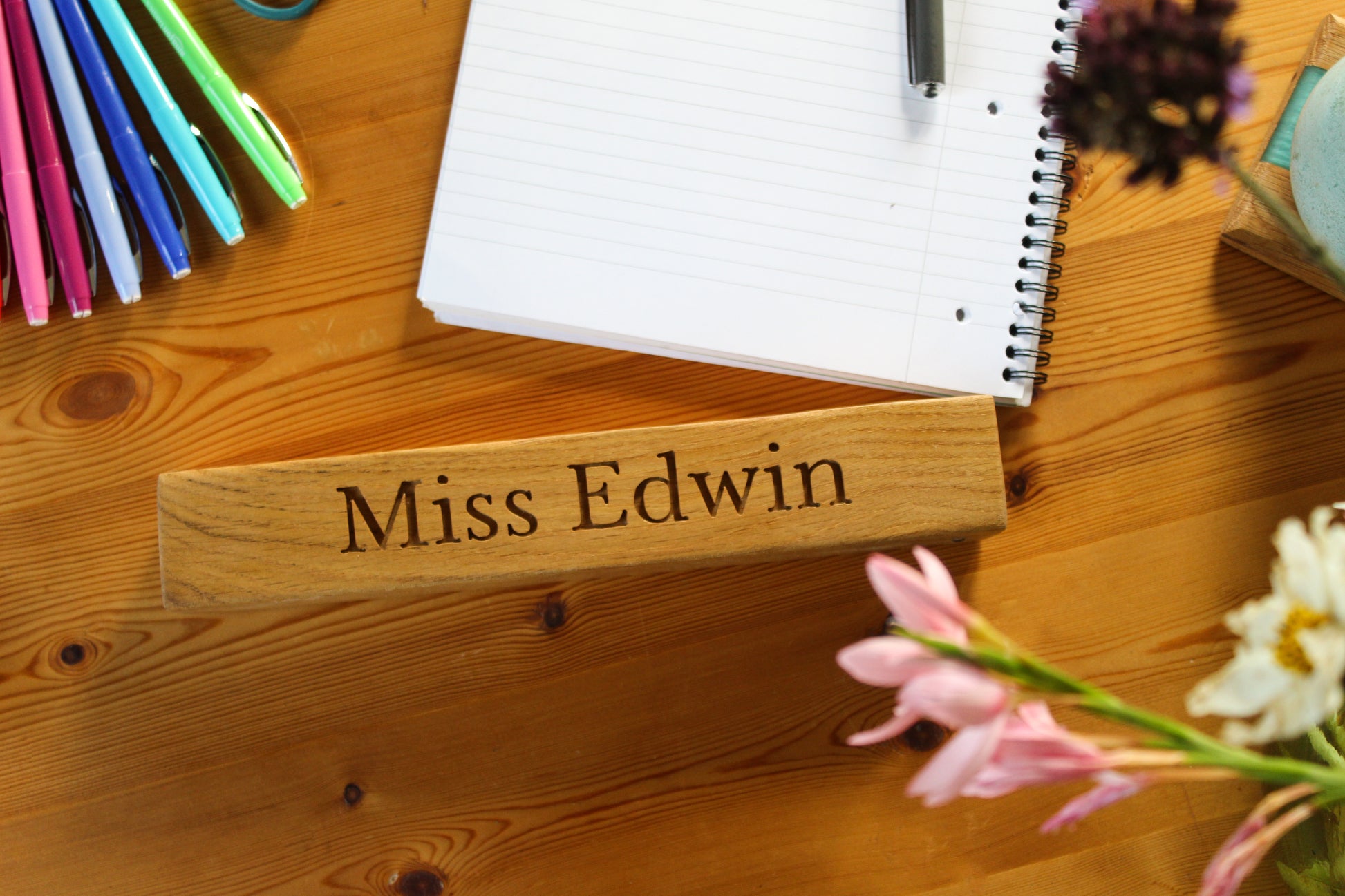 Teacher's desk with wooden name plaque