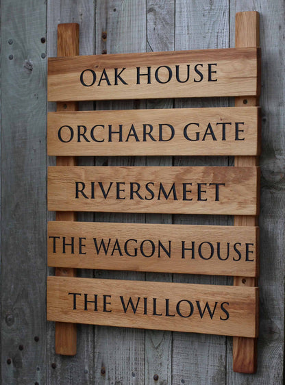 Wooden sign with engraved text on a wooden background